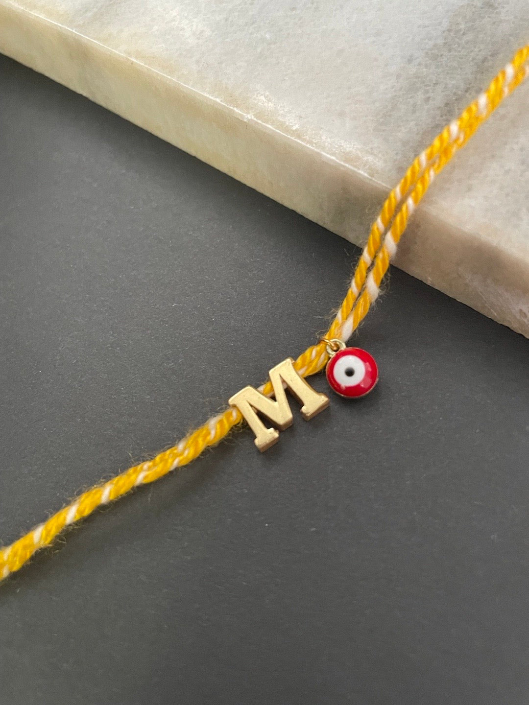Initial Rakhi