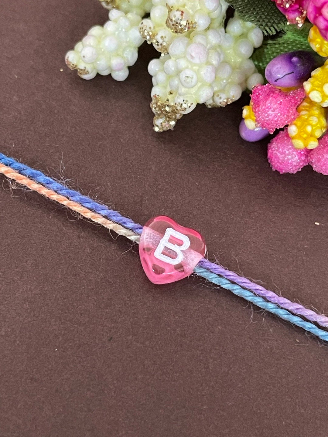 Initial Letter Rakhi