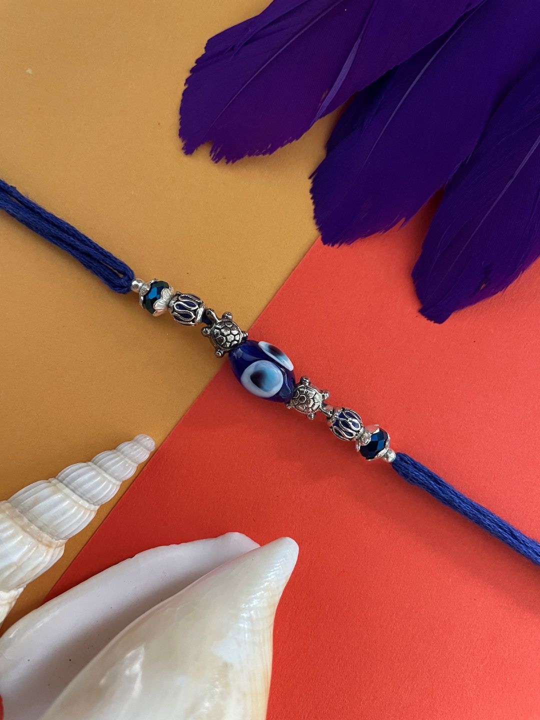 Tortoise/Evil Eye Charm Rakhi Lumba
