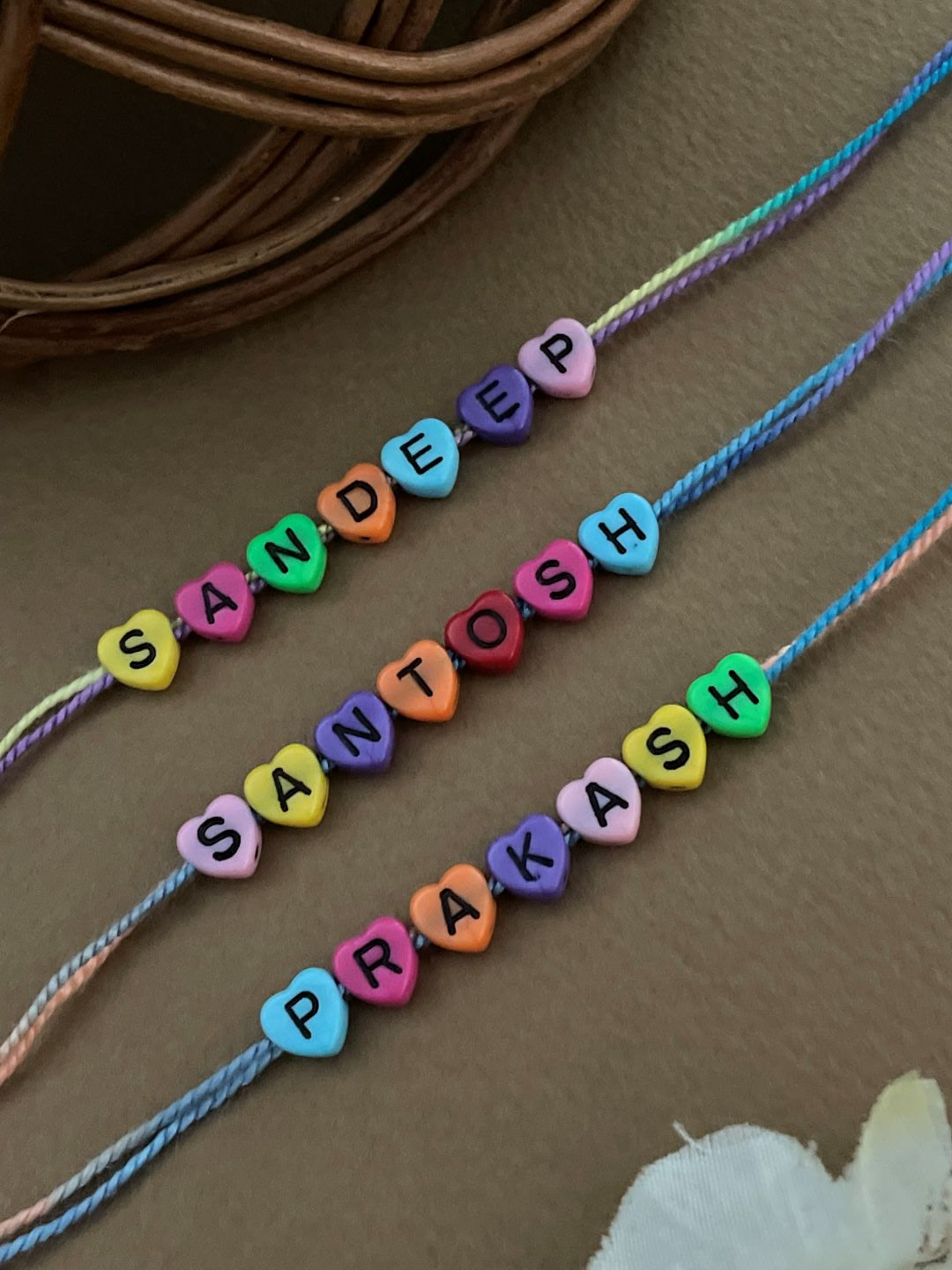 (Combo of 3) Custom Name Rakhi in Multcolor Color Heart Shaped Beads In MultiColor Thread