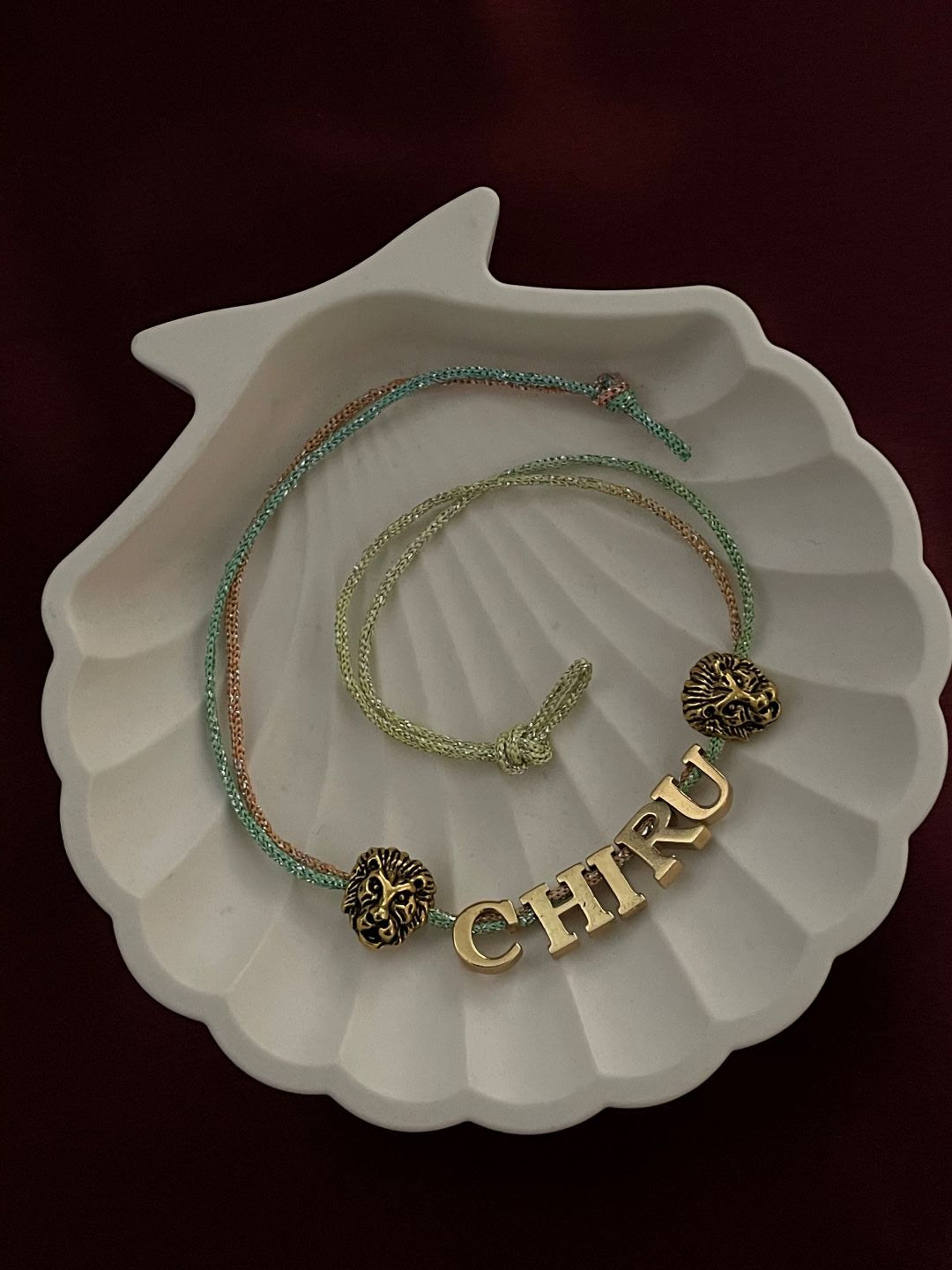 Gold Plated Name Rakhi With 2 Lion Charms
