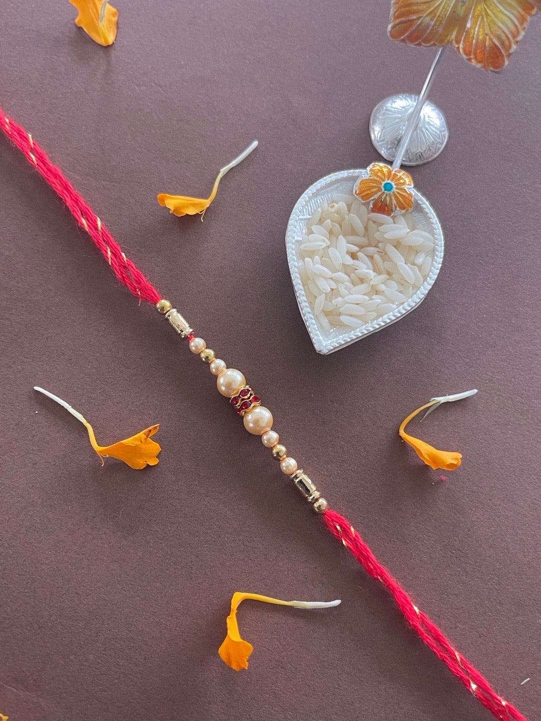 Pearl on sale rakhi designs