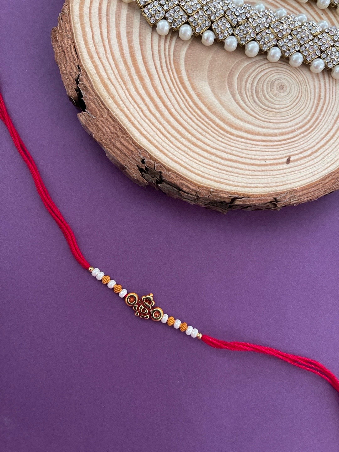 Latest Designer Rakhi Ganesha God With Moti And Beads Red Thread Rakhi For Rakshabandhan