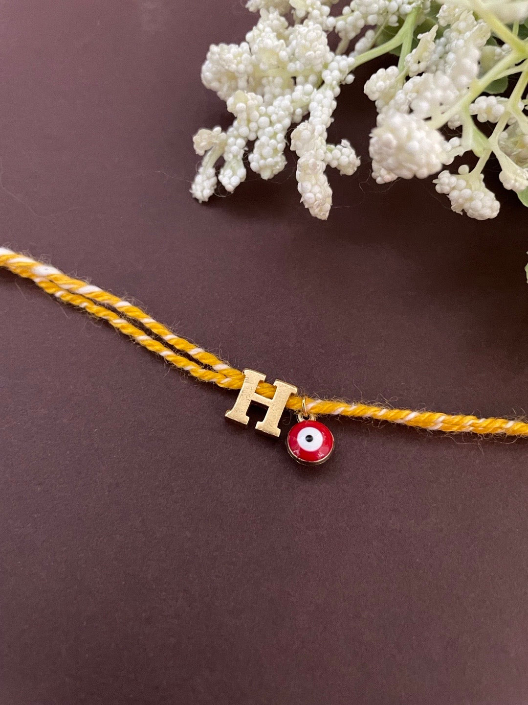 Initial Rakhi