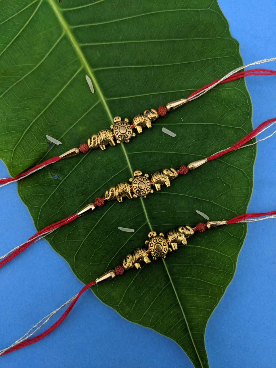 Trendy Rakhi designs with Tortoise/Elephant/Rudraksha Beads Pendant