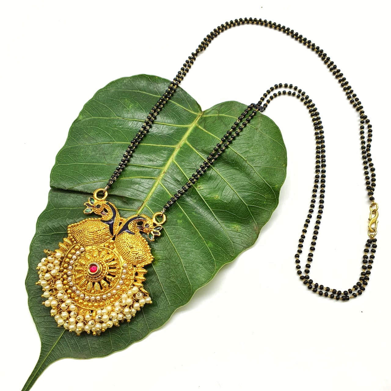 Gold locket mangalsutra on sale design