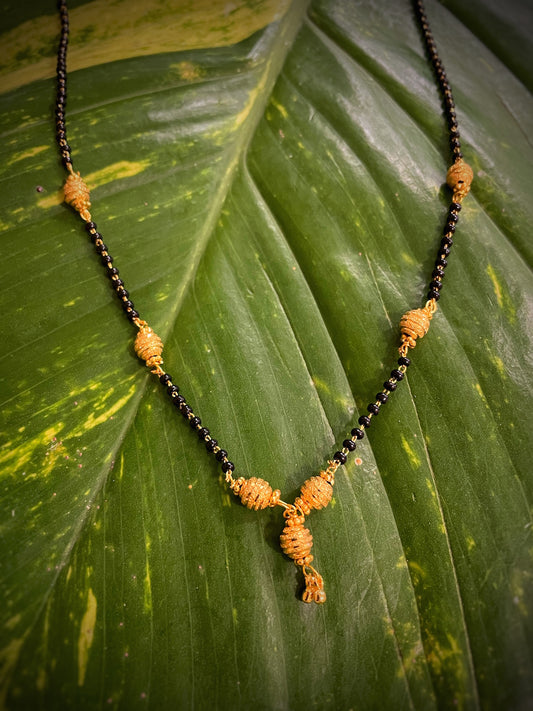 Short Mangalsutra Designs Sphere Pattern Gold Plated Black/Gold Beads Pendant with Latkan (19 Inches)