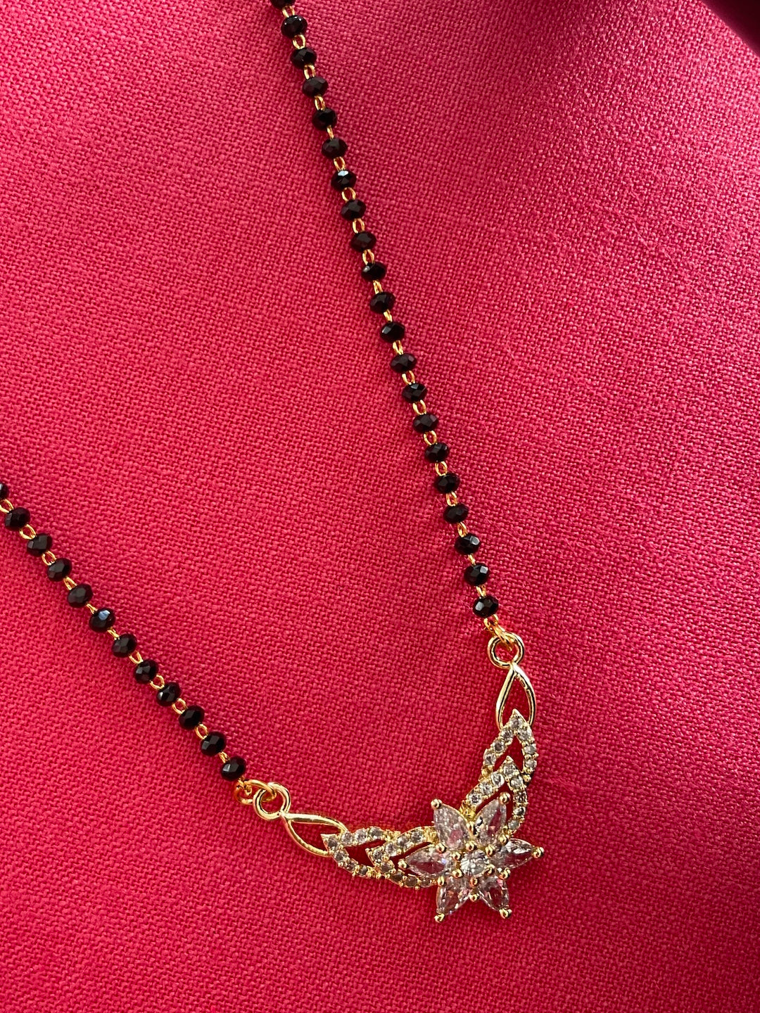 Short Mangalsutra Designs Gold Mangalsutra with Flower Shape Diamond Pendant (Length 21 Inches)