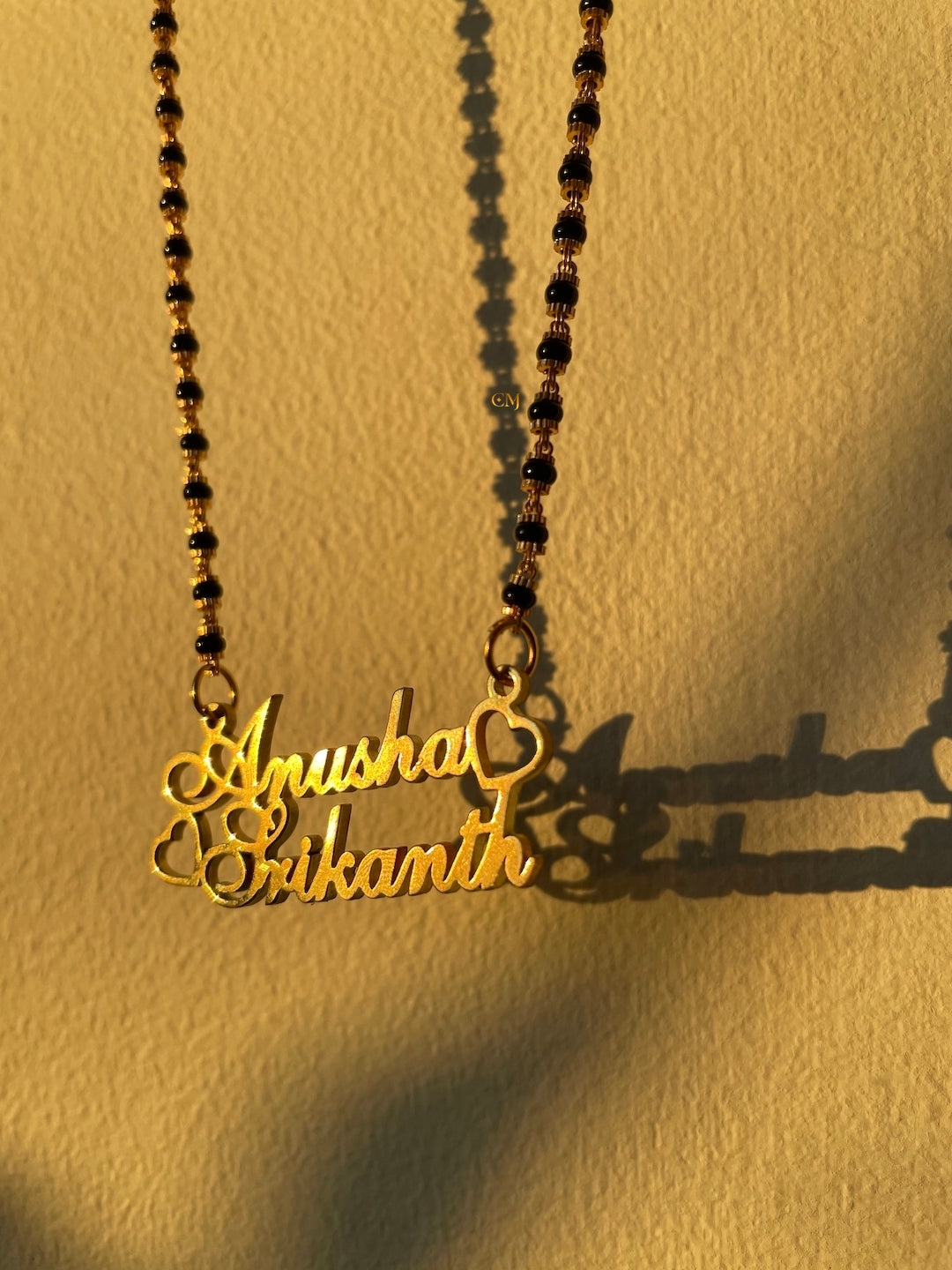 letter name mangalsutra design