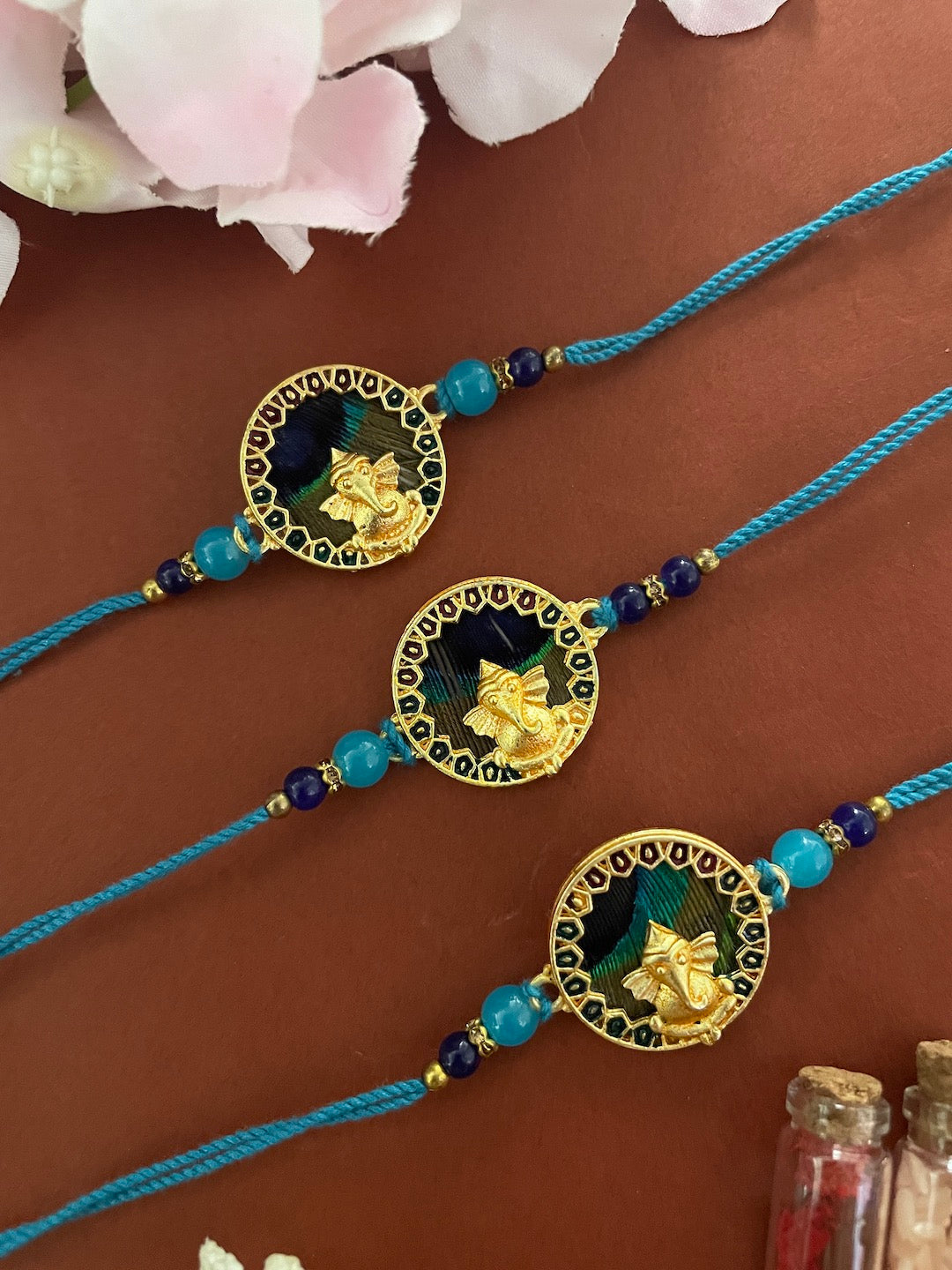 Shop (Set of 3) Ganesh Peacock Feather Rakhi Online – Digital Dress Room