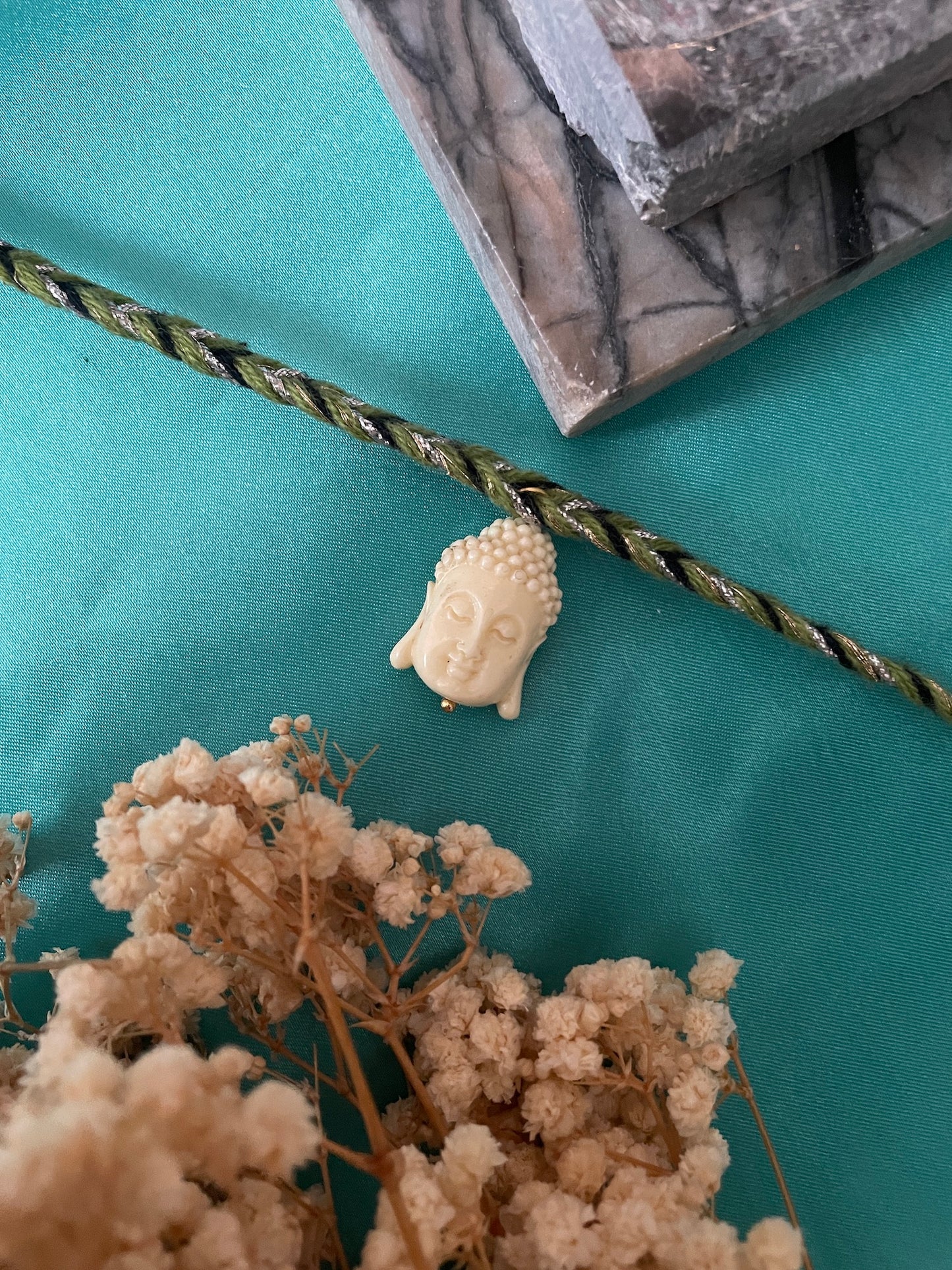 White Buddha Charm Rakhi Lumba