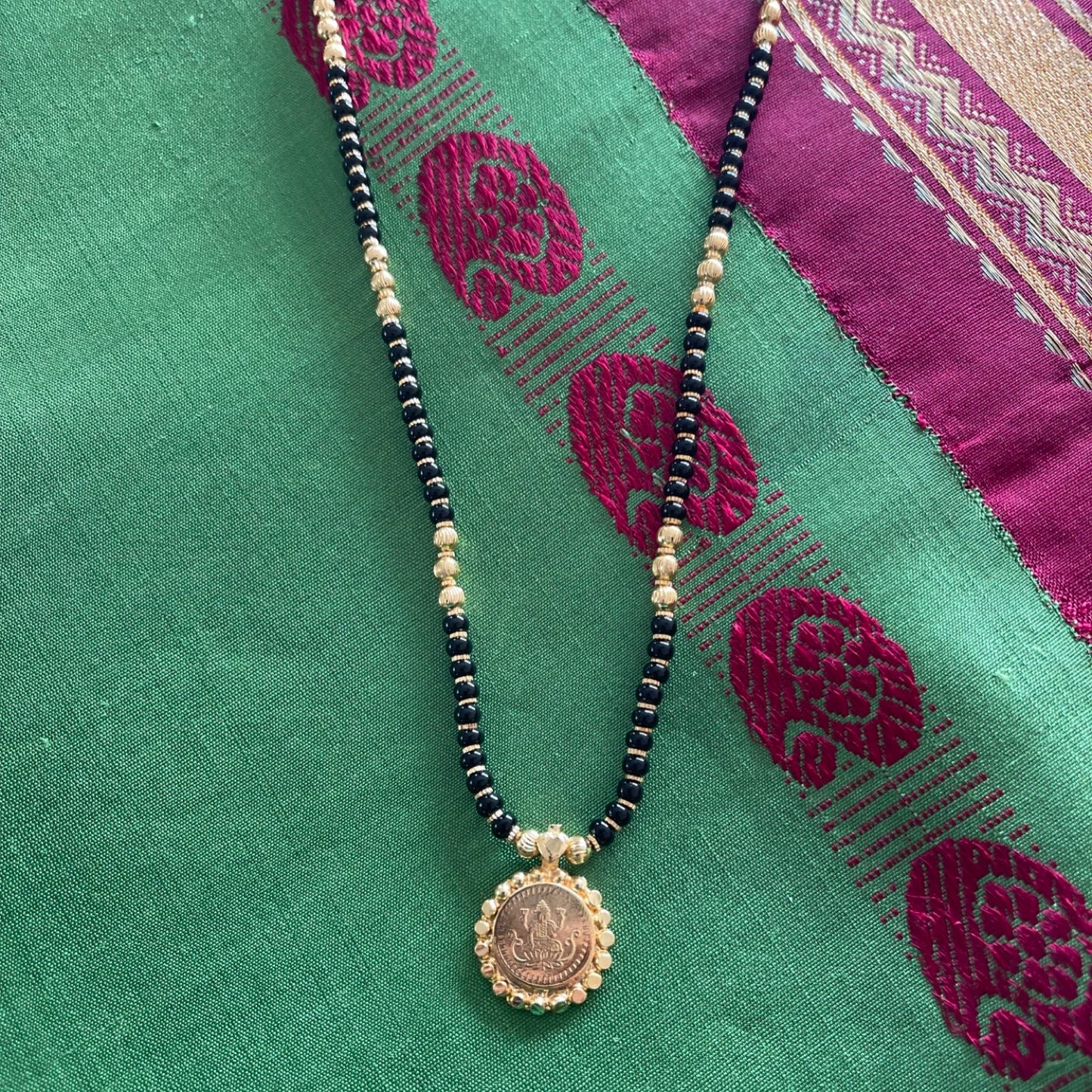 Short Traditional South Indian Mangalsutra Designs Lakshmi (Laxmi) Coin Gold & Black Beads Chain