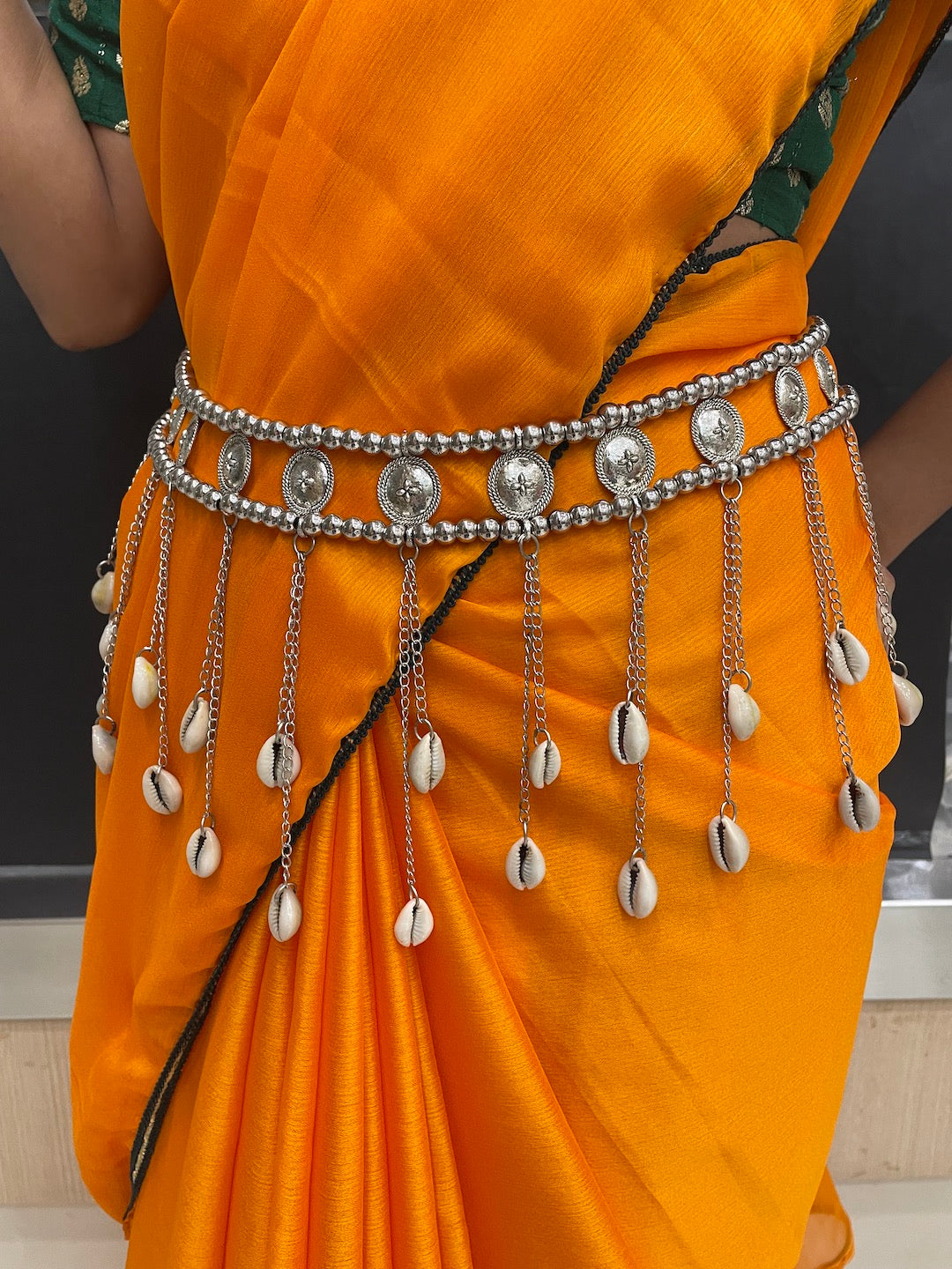 Minimalist gold kamarband on saree.