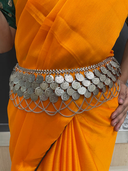 Silver kamarband for festive outfits.