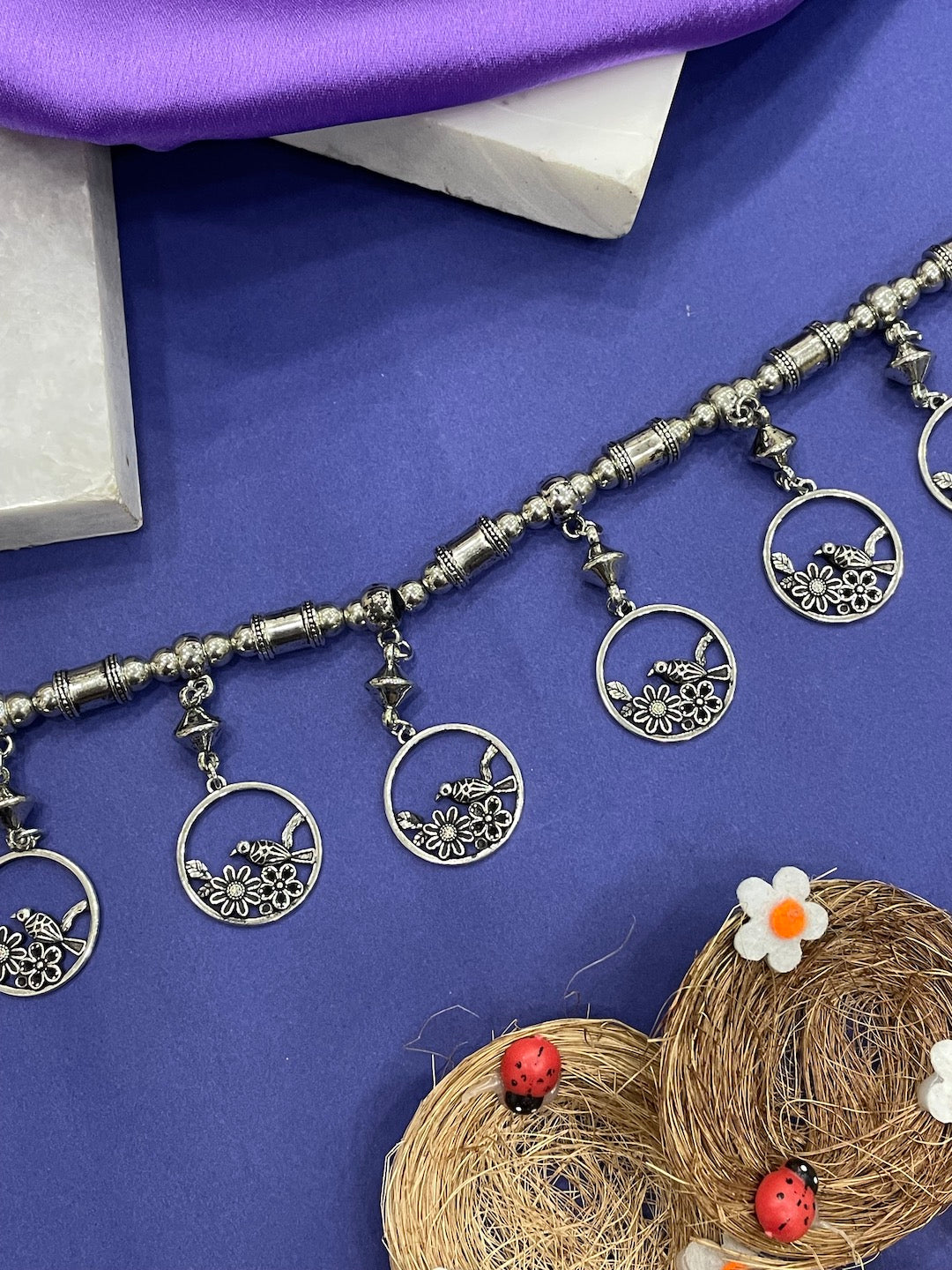 Oxidized silver kamarband with floral design.