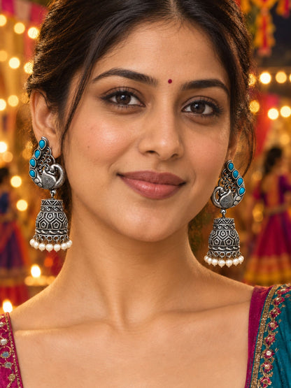 Silver Peacock Jhumka Earrings with Blue Stones