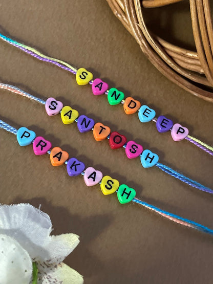 (Combo of 3) Custom Name Rakhi in Multcolor Color Heart Shaped Beads In MultiColor Thread