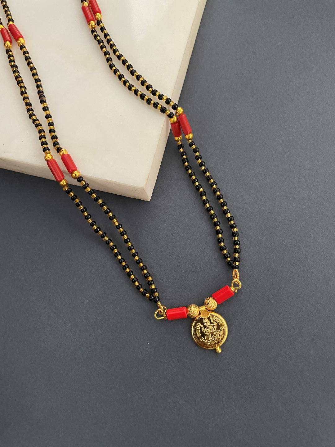 Short Mangalsutra with Laxmi Pendent Black Gold and Orange Beads