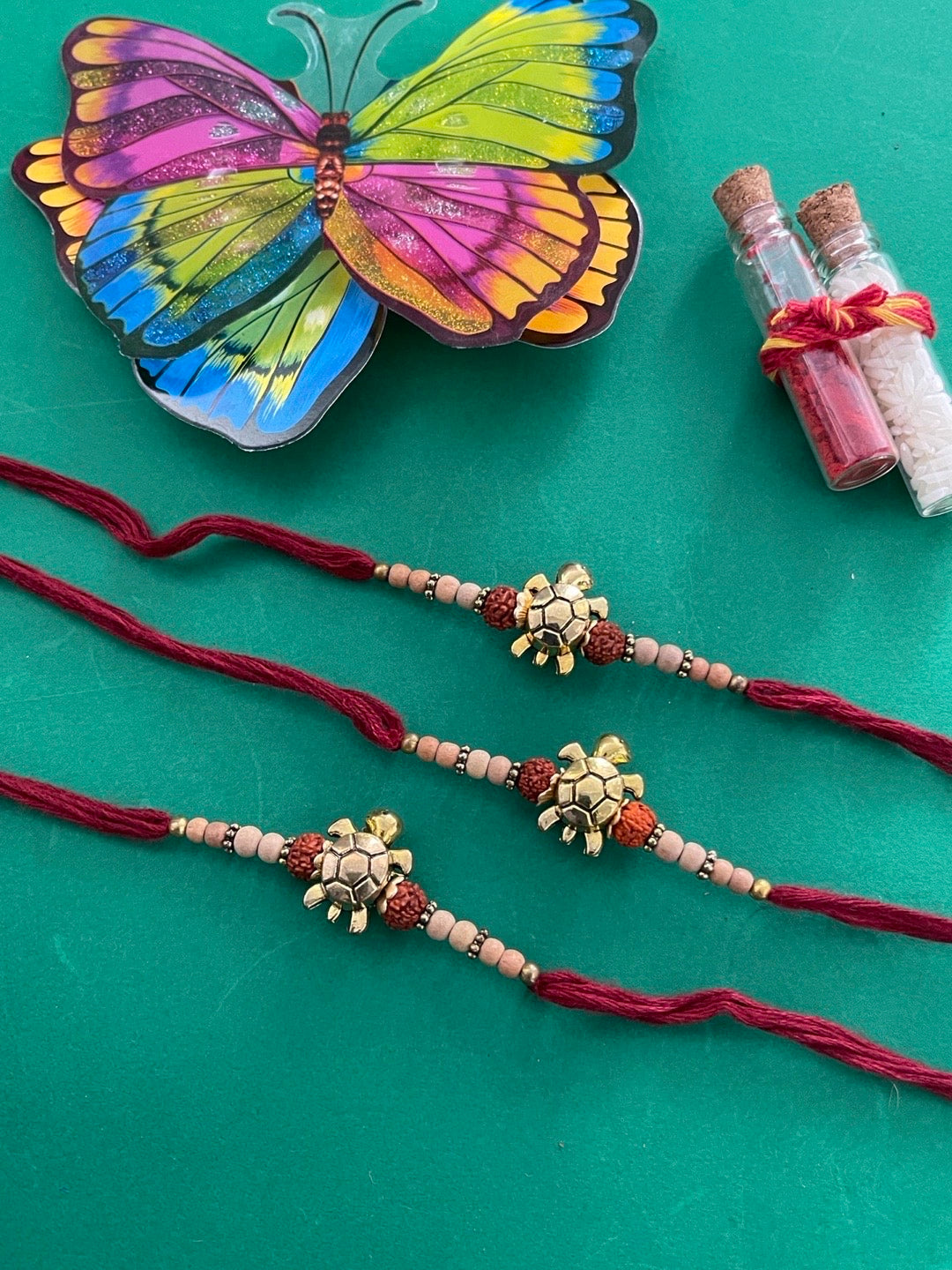 (Set of 3) Tortoise Designer Rakhi for Men Gold Plated Rudraksha Tulsi Beads Maroon Thread Rakhi
