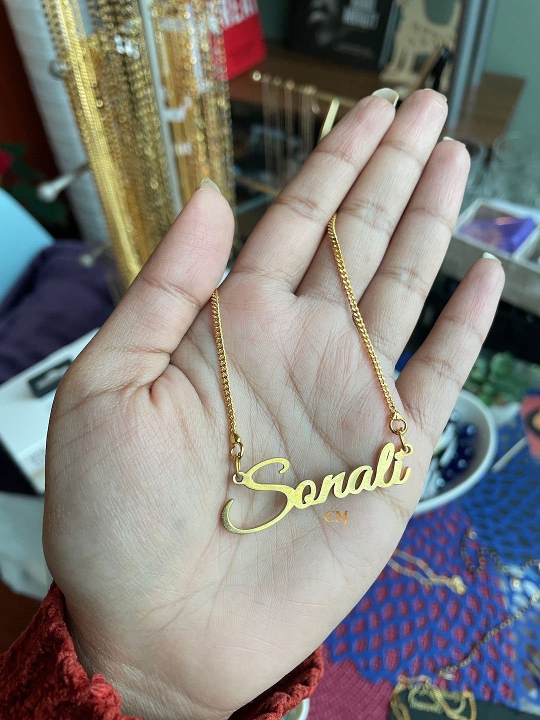 Gold chain name on sale locket